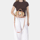 Dinky Organic Cotton bag in Soft Pear & Posy, model shot 2